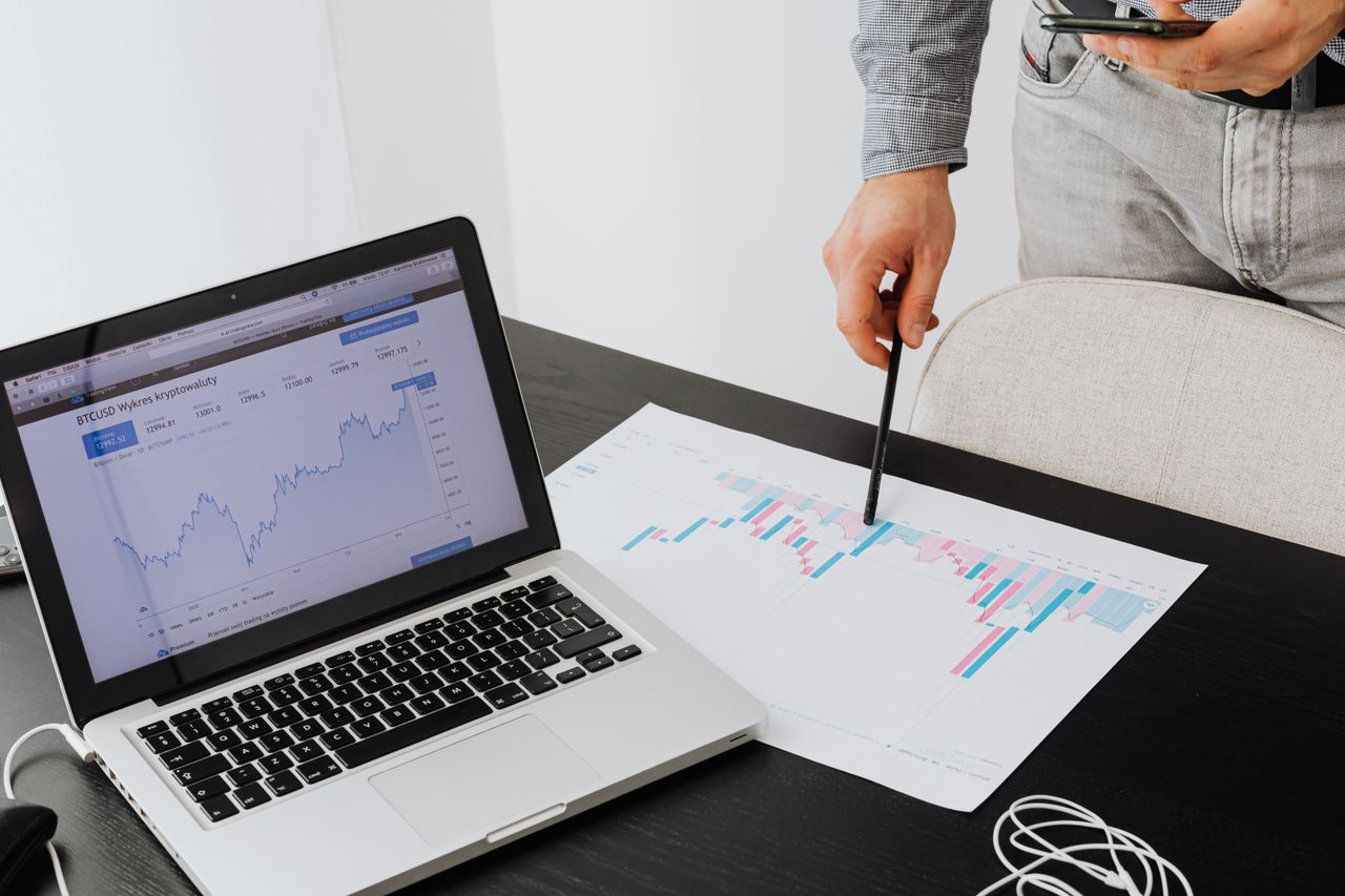 home-services-004 Person analyzing cryptocurrency data using a laptop, highlighting financial insights.